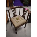 A period oak corner smokers bow style chair having tapestry seat, previously wormed and treated