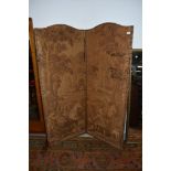 A vintage two panel room divider, having damask style hunting and foliate decoration and leather