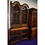 An early 20th Century oak bookcase, having double dome top, interesting design, width approx. 100cm,