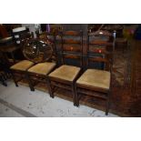 A set of vintage stained frame ladderback chairs