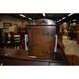 A traditional oak smokers cabinet