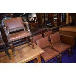 A set of five (four plus one) early 20th Century oak and studded leather dining chairs