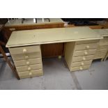 A cream painted dressing table, width approx. 145cm