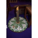 A tile mosaic parasol base