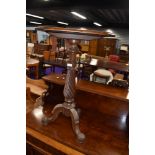 A Victorian oak occasional table on twist column and triple shaped legs