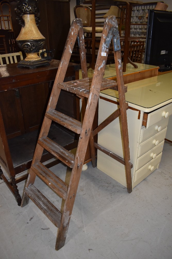 A vintage wooden step ladder