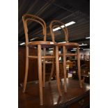 A pair of stripped bentwood high seat chairs