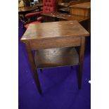 An early 20th Century oak side table with ply undertier, width approx 56cm