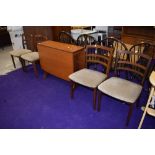 A vintage G plan or similar teak gateleg table and four rail back chairs, chairs labelled as G plan