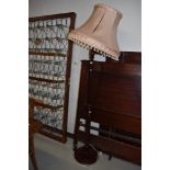 A traditional mahogany effect standard lamp