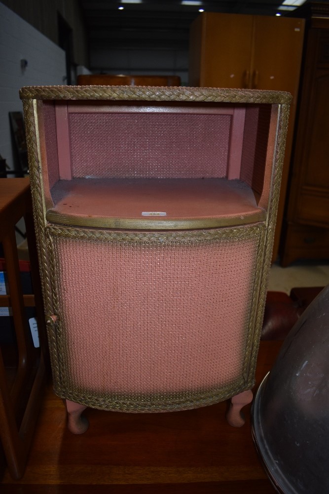 A woven fibre bedside cabinet