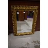 A vintage plastic gilt effect wall mirror, approx. 66 x 50cm