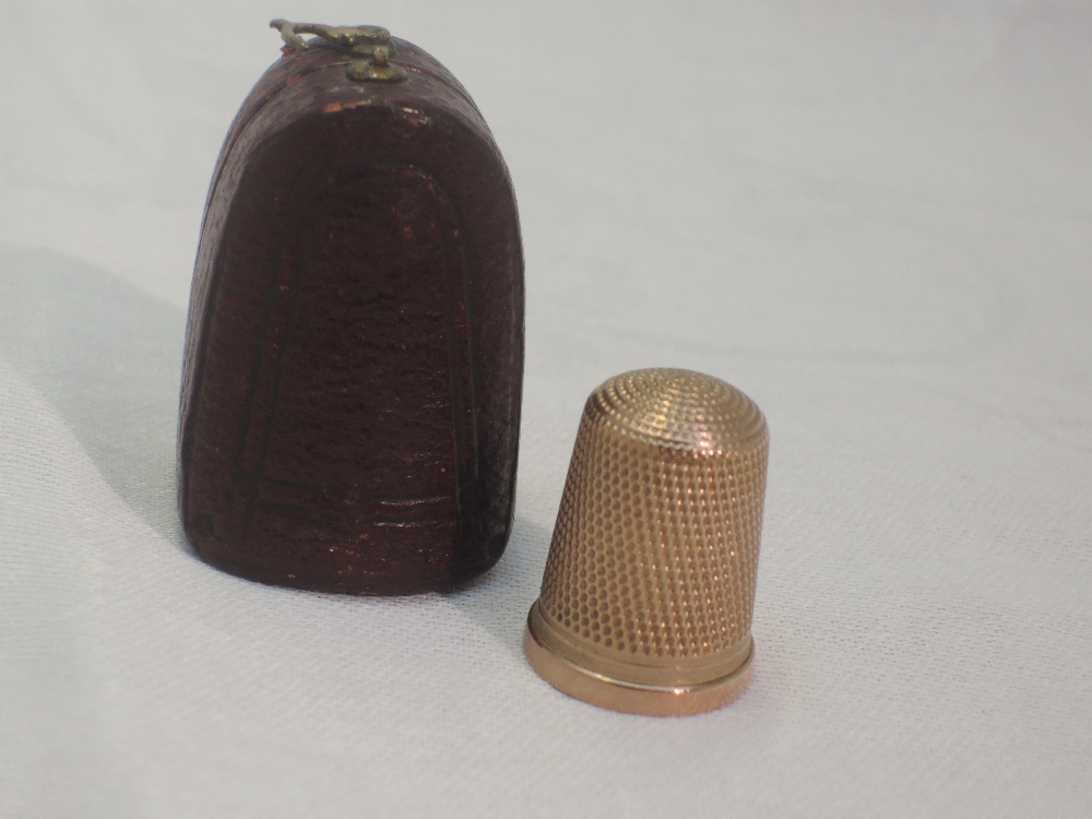 A 9ct rose gold thimble of traditional form with travel case, Birmingham, possibly 1918, James