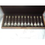 A RSPB members edition cased silver spoon collection having 12 spoons with gold plated bird