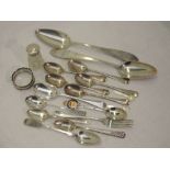A selection of HM silver and white metal spoons including souvenir, teaspoons and table spoons, a