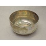 A silver bowl of plain circular form on a circular foot, London 1919, Charles Boyton & Son Ltd,