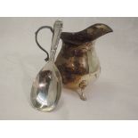 A silver caddy spoon, Sheffield 1952, Pinder Brothers, and a small Edwardian silver cream jug of