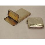 A Victorian silver card case of plain form having hinged flap lid and gilt interior bearing stamp