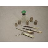 A small selection of HM silver and white metal including thimbles, small scent bottle having green