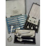 A selection of HM silver and white metal cased flatware including coffee spoons, butter knives,