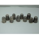 Nine silver thimbles of various patterns, all Chester hallmark dates from 1888 - 1923, all maker