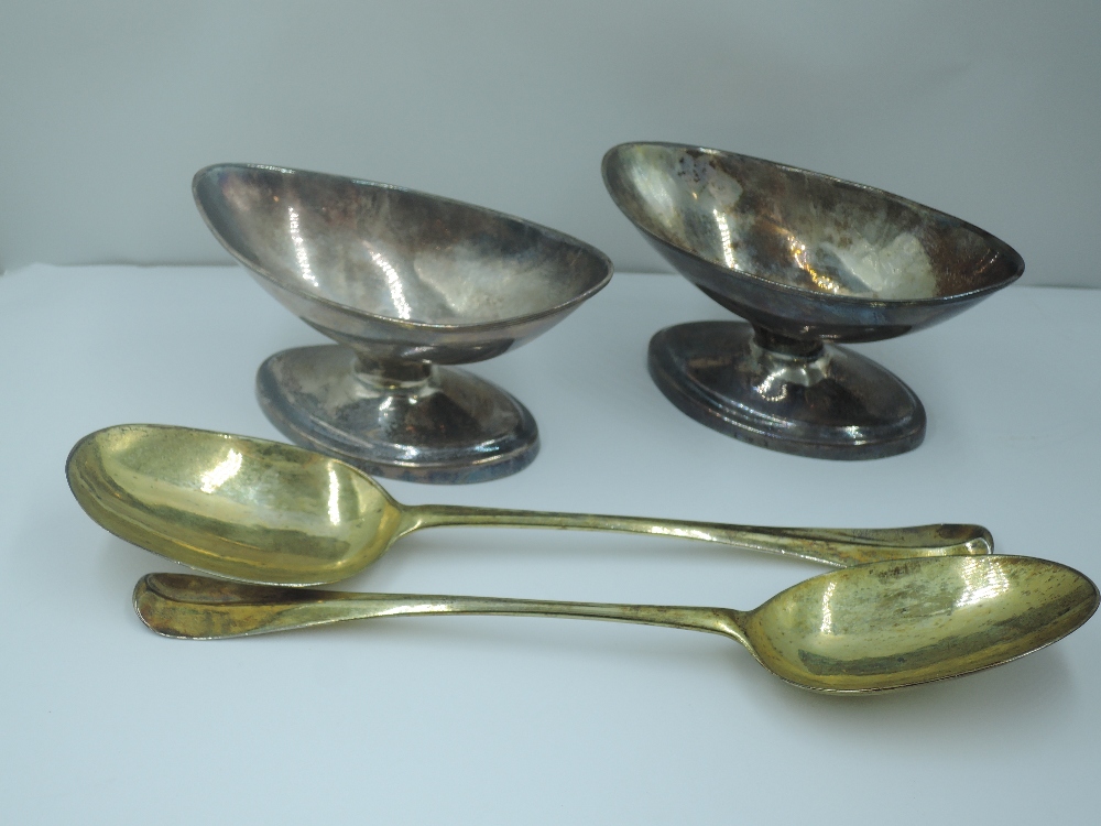 A pair of Georgian Scottish silver salts of plain navette form on pedestal feet, Edinburgh hallmarks