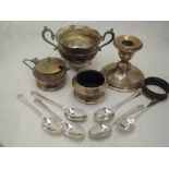 A selection of HM silver including a squat candle stick, mustard and salt, sugar bowl and set of six