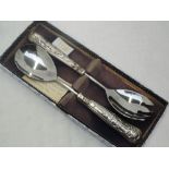 A cased set of salad servers having moulded silver handles in the Kings pattern, Sheffield 1973,