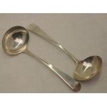 A pair of Georgian silver ladles of plain form bearing sun burst crest to terminals, London 1802,