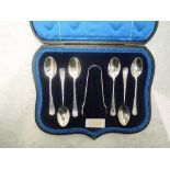 A cased set of six silver teaspoons with matching sugar nips all having brightcut decoration to