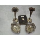 A pair of Edwardian silver trinket dishes of oval form having pierced decoration and scroll rims,