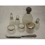 A selection of cut glass dressing table and scent bottles having HM silver collars/lids, and a