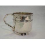 A silver christening mug having reeded decoration and inscribed Eric 1919, Birmingham 1920, Deakin &