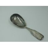 A Scottish silver caddy spoon having shaped oval bowl and monogram to terminal, Glasgow 1823,