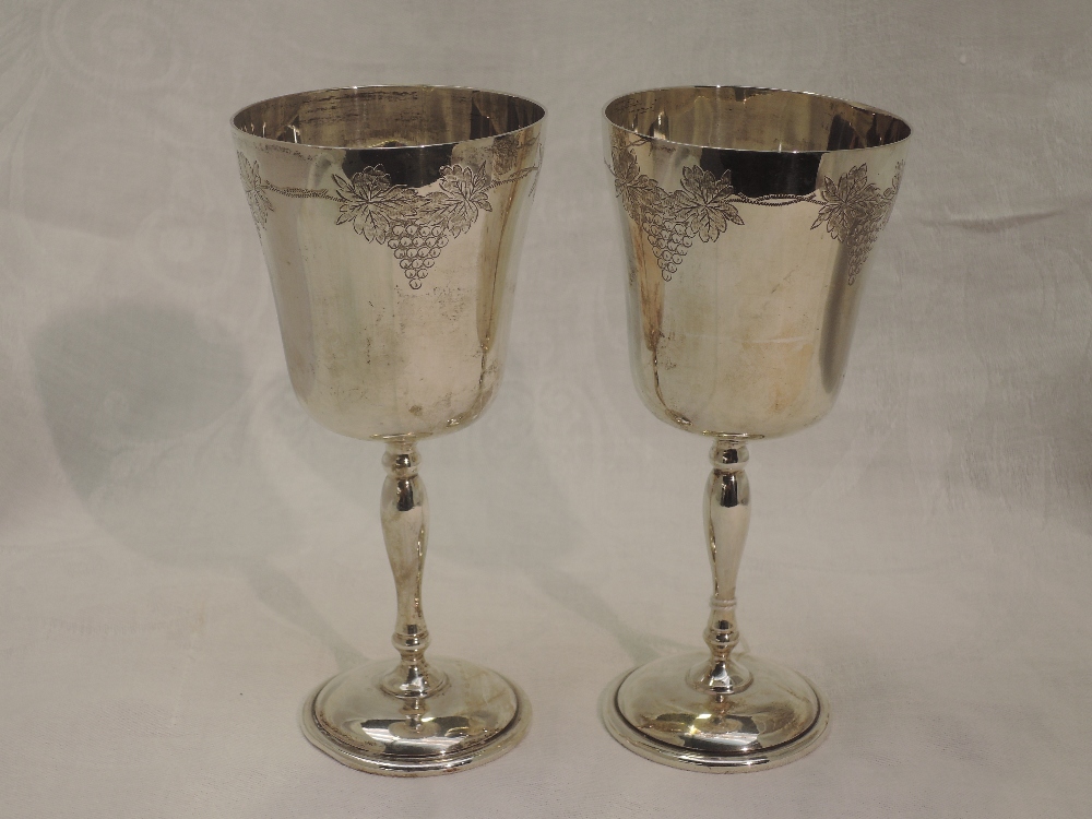 A pair of silver wine goblets having engraved grape vine decoration, Birmingham 1990, Charles S