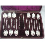 A cased set of twelve Victorian Apostle teaspoons with matching sugar nips, all having twist stems