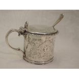 A Victorian silver mustard pot of drum form having engraved decoration, hinged lid and blue glass