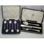 A cased set of six silver coffee spoons having coffee bean knops, Sheffield 1932, Walker & Hall, and