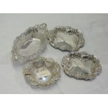 Four HM silver trinket dishes of various forms having moulded and pierced decoration, approx 121g