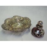 A Victorian silver trinket dish having embossed and pierced decoration and bun feet, Birmingham