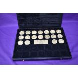 A collection of 18 different Jean Dassier Kings and Queens Medallions in presentation box