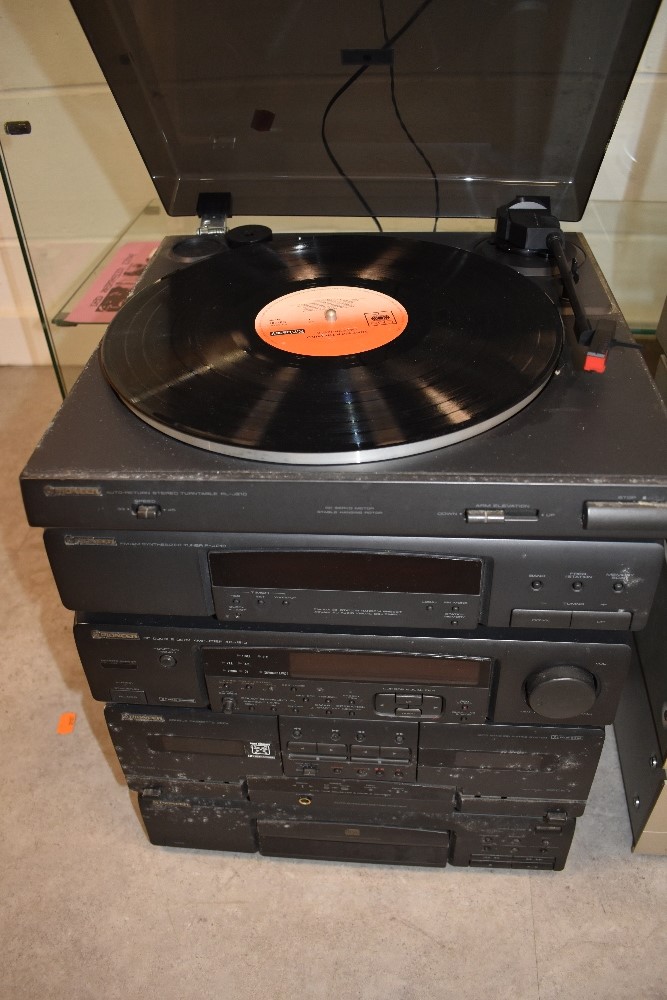 A modern Pioneer stackable stereo system including record player