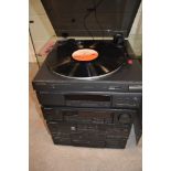 A modern Pioneer stackable stereo system including record player