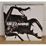 A copy of 'Mezzanine ' by Massive Attack ex / ex