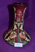 A Moorcroft vase, masquerade designed by Rachel Bishop, having rose and cornflower design to