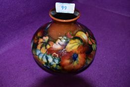 A Moorcroft squat Baluster vase in Orchid pattern circa 1950s.