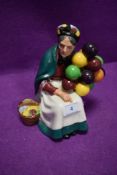 A Royal Doulton figurine of the old balloon seller having green back stamp