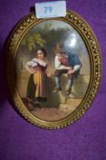 A finely detailed and hand painted porcelain plaque of two young lovers in a continental style in