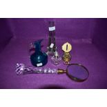 A selection of glass including long handled faceted magnifier,perfume bottle,jug and vase.