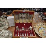 A partial canteen of vintage stainless steel and plated cutlery.